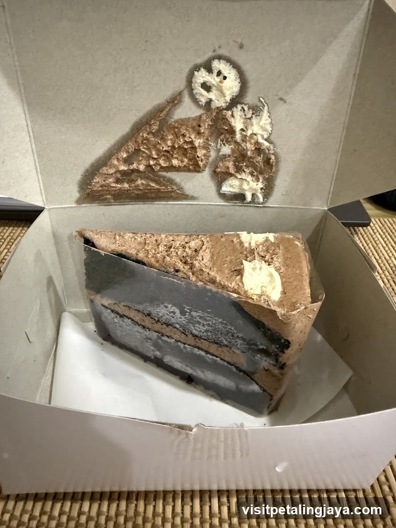 Slice of layered cake in box