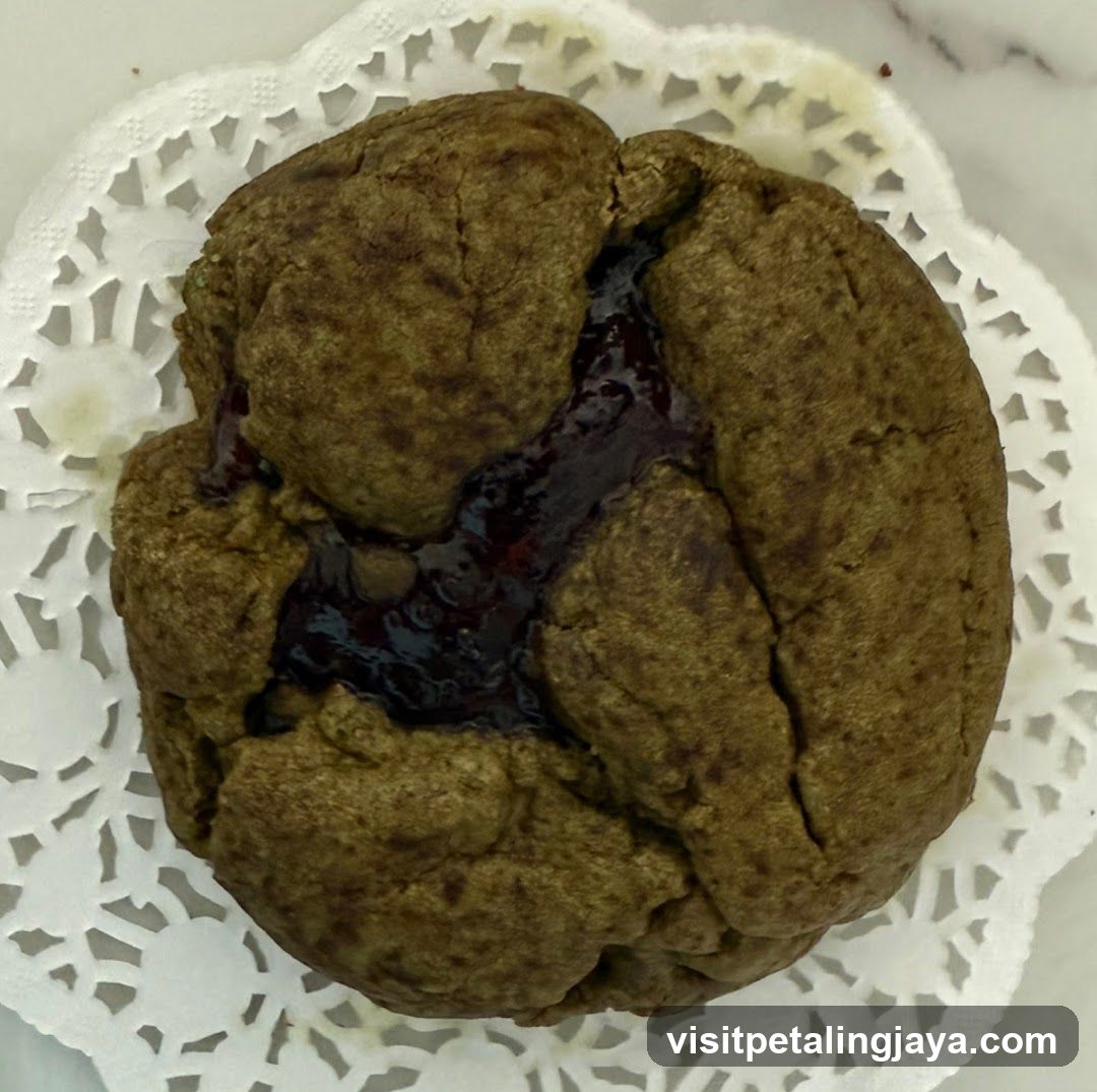 Jam-filled cookie on doily