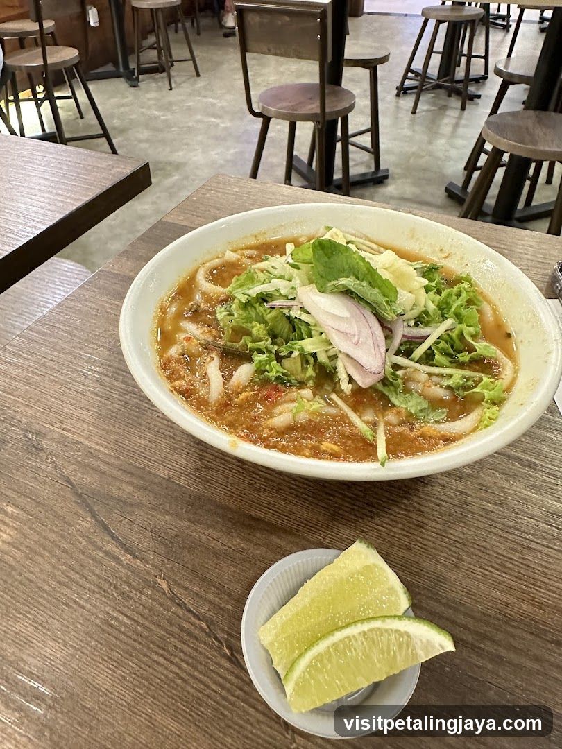 Bowl of Soup with Lime Wedges