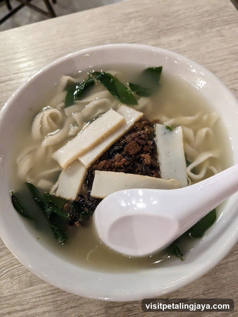 Bowl of Noodle Soup with Tofu and Greens
