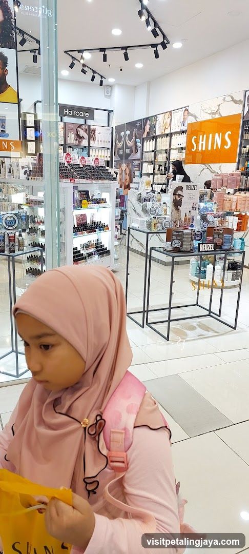 Beauty Store Interior with Child in Foreground