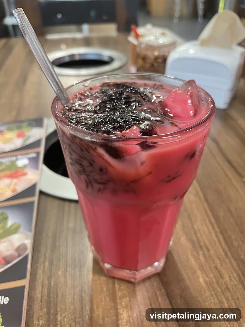 Red Iced Drink with Black Toppings