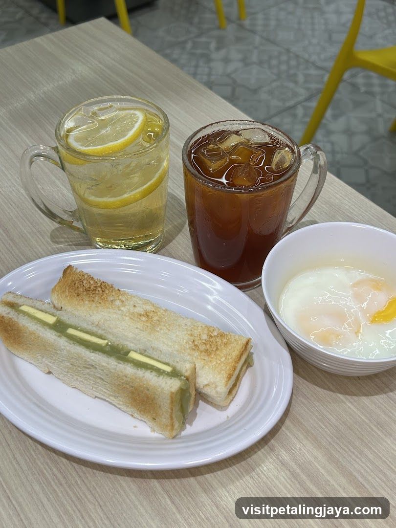 Breakfast Spread with Sandwich and Drinks