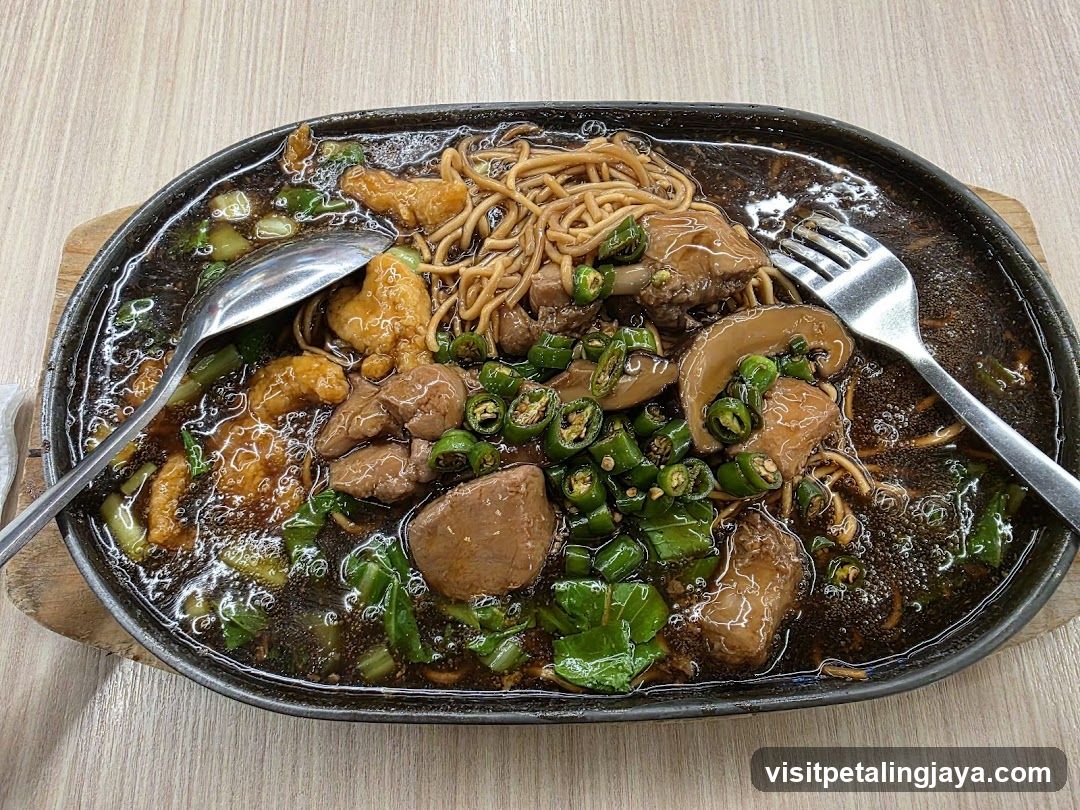 Sizzling Meat and Noodles Dish