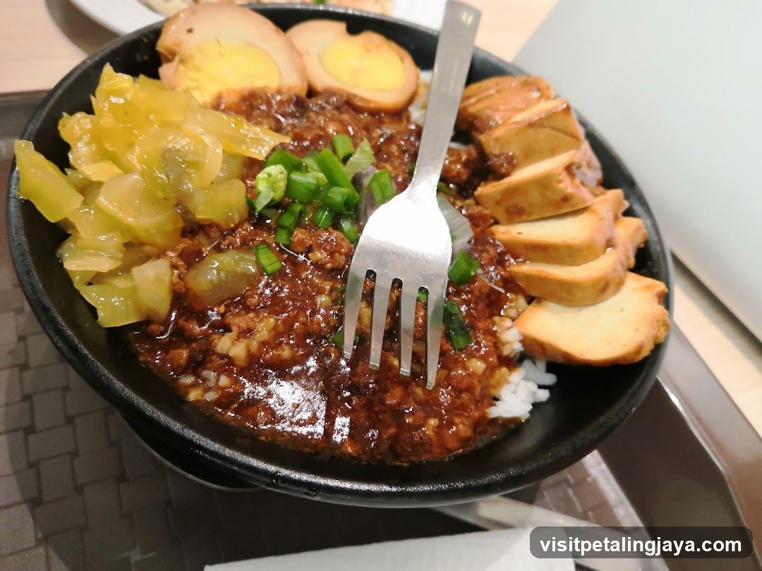 Bowl of savory rice dish with toppings
