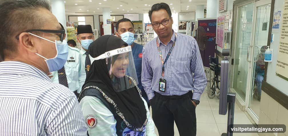 Healthcare Staff and Visitor in Clinic Interior