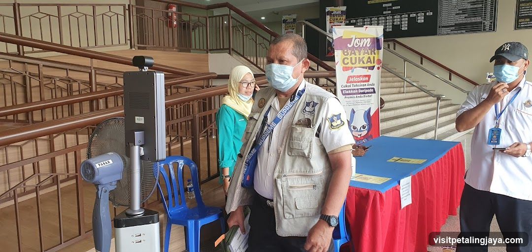 Indoor Event Setup with Staff and Equipment