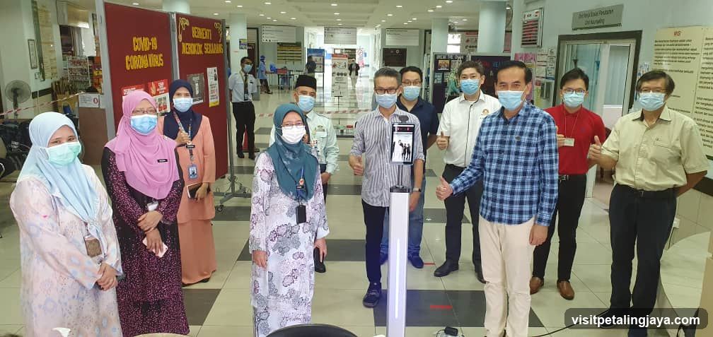 Group of people in a hospital or clinic hallway