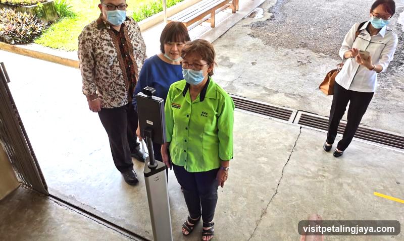 People at Entrance with Security Scanner