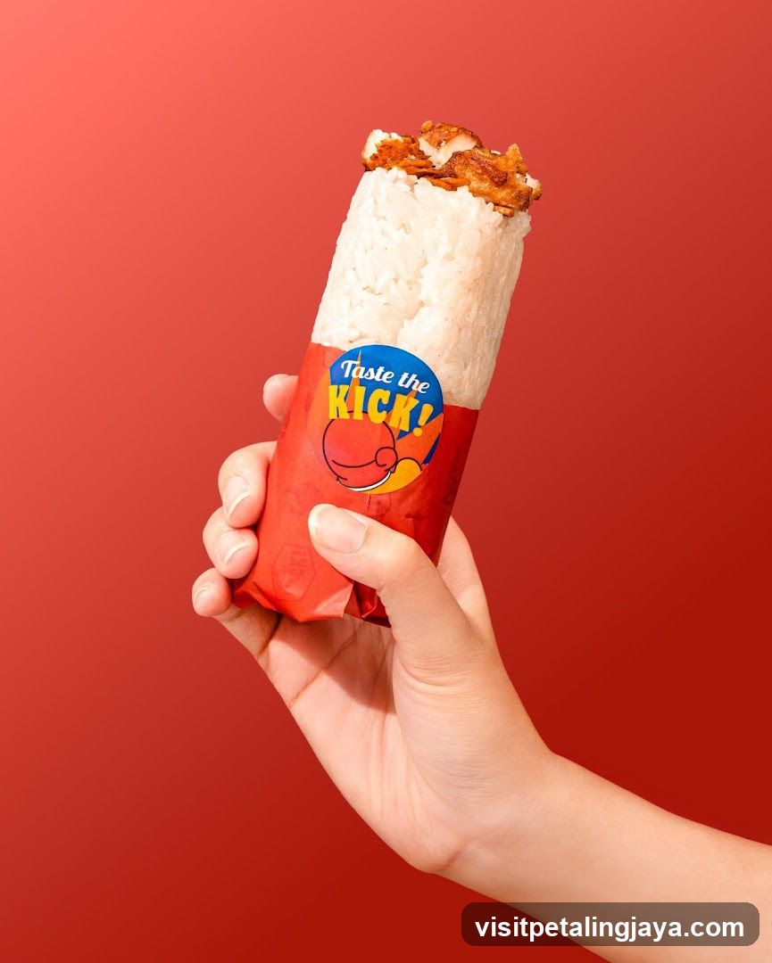 Hand holding a wrapped food item