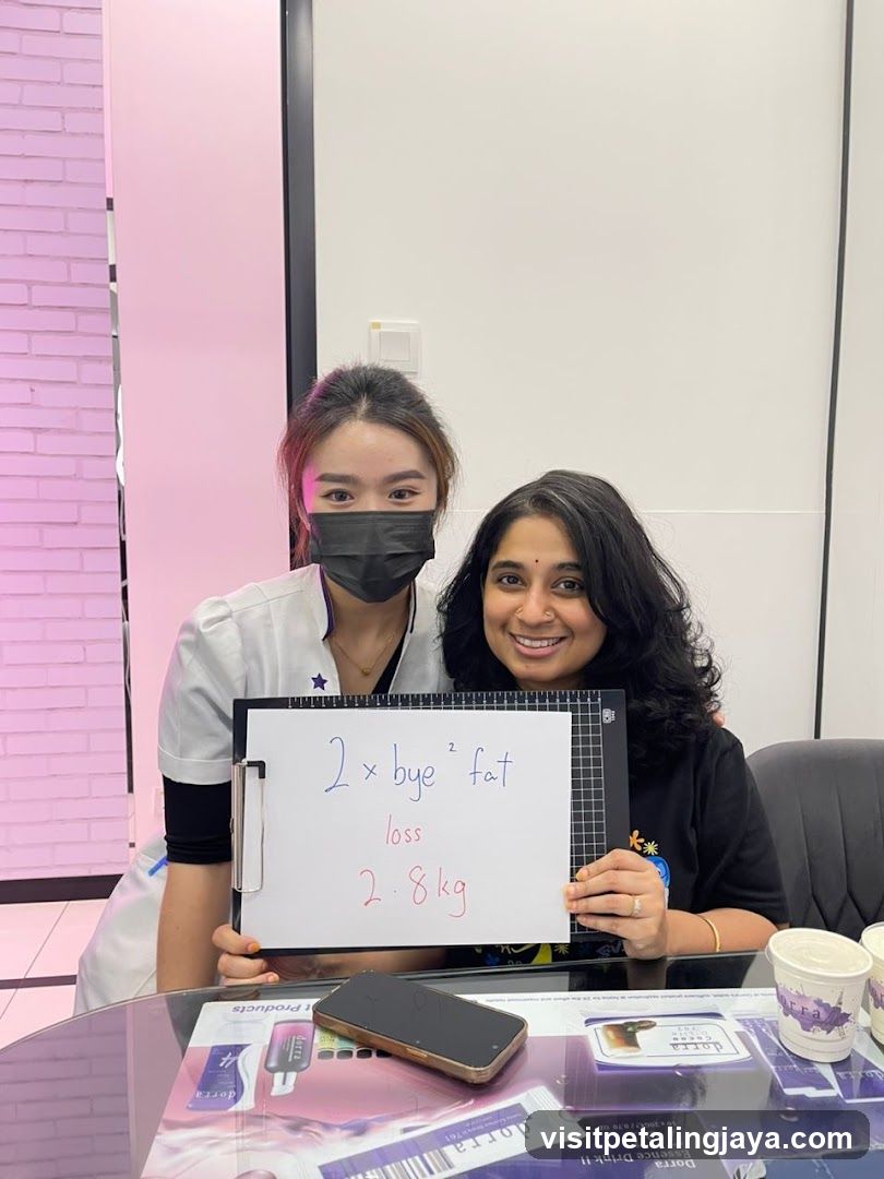 Two individuals in a room holding a sign