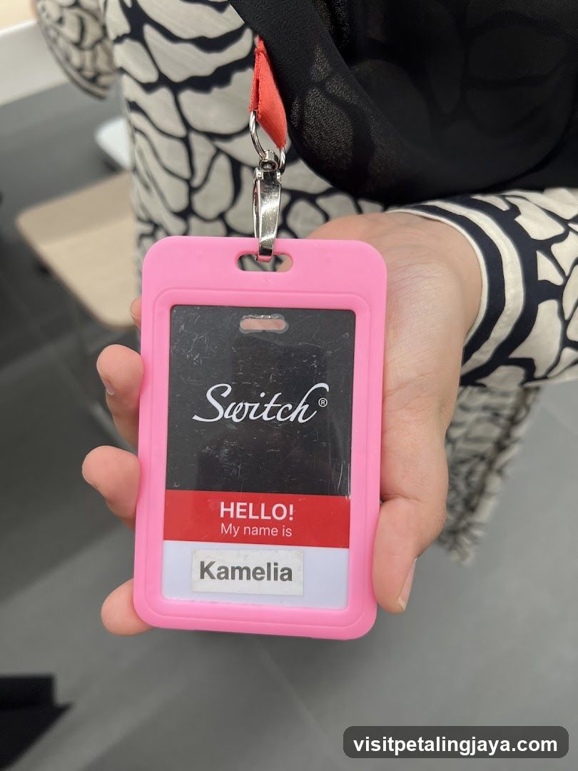 Name badge held by staff