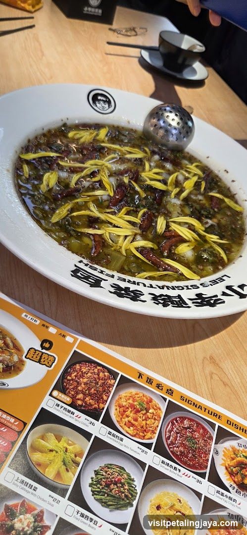 Dish with pickled vegetables and yellow garnish