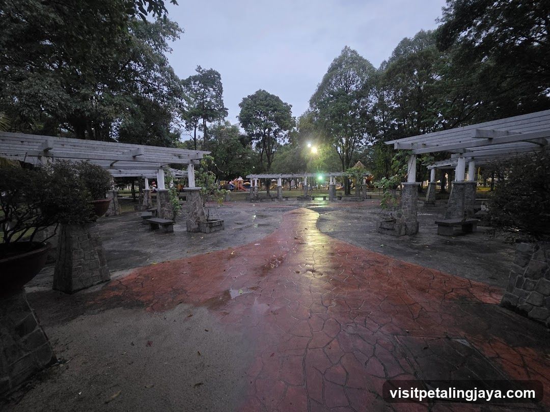 Evening Park Scene with Wet Ground