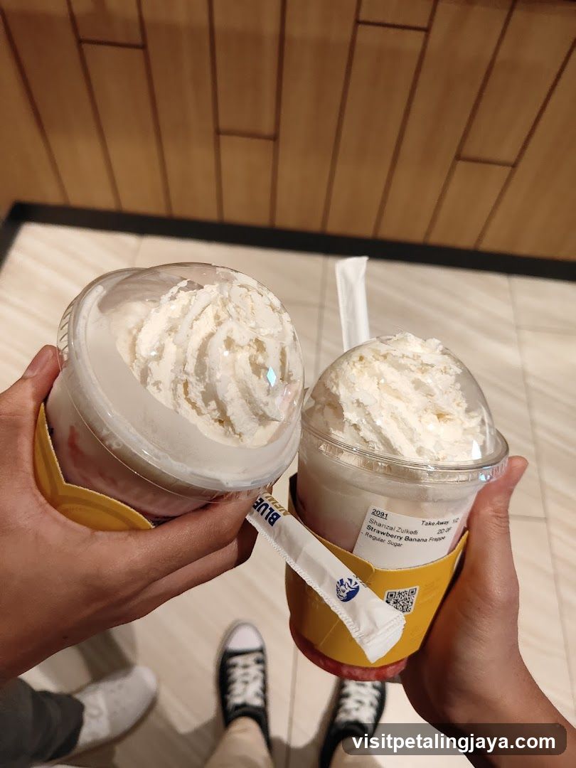 Two iced drinks with whipped cream