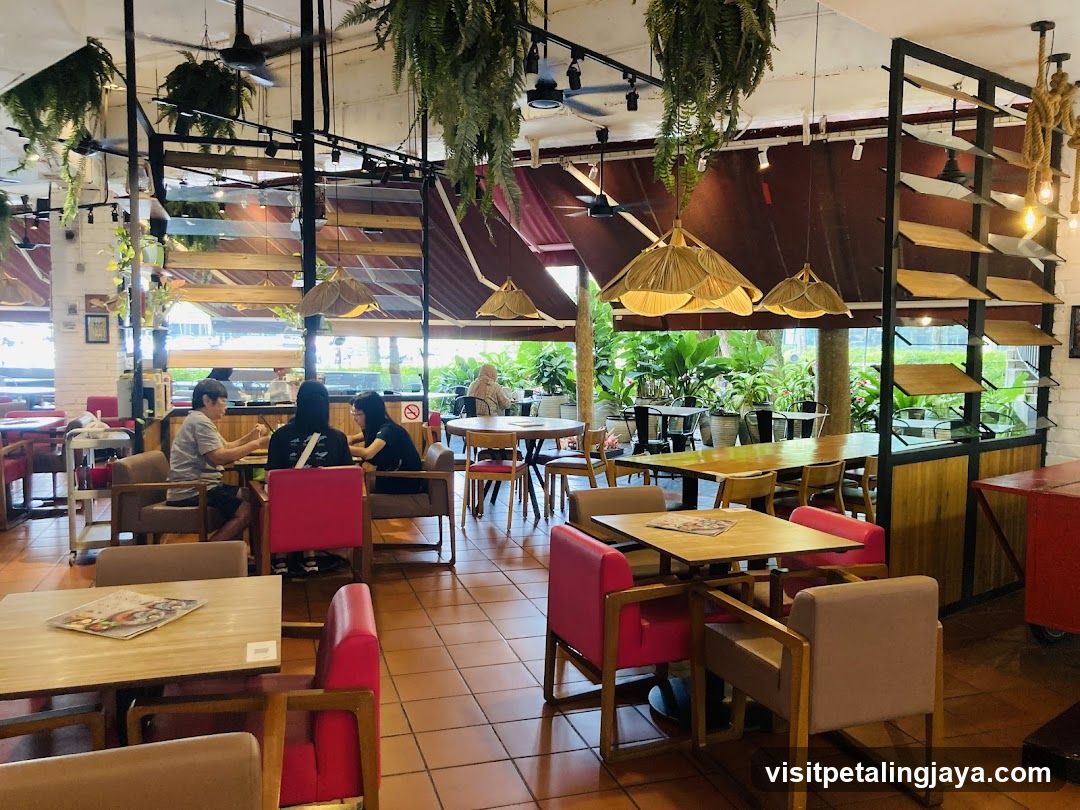 Restaurant Interior with Greenery and Seating Areas