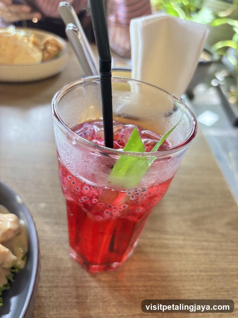 Red Drink with Straw and Garnish