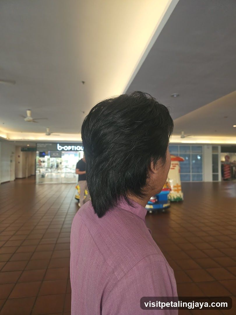 Person in Mall Corridor