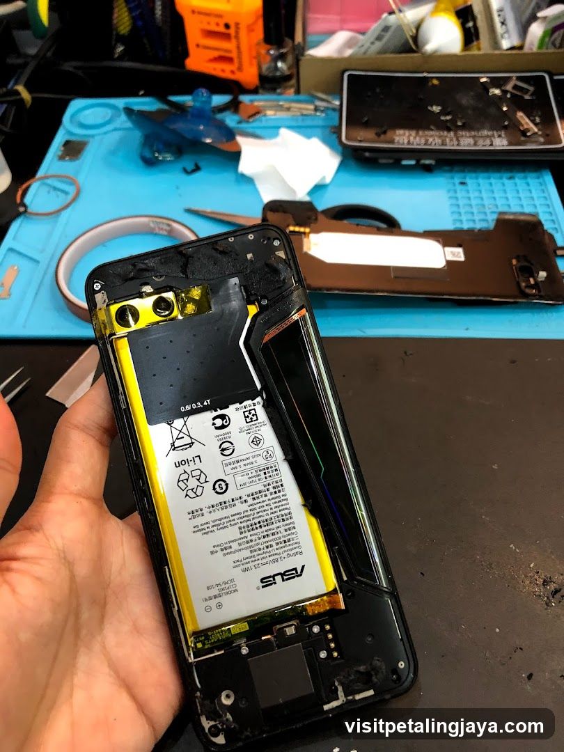 Disassembled Smartphone on Workbench