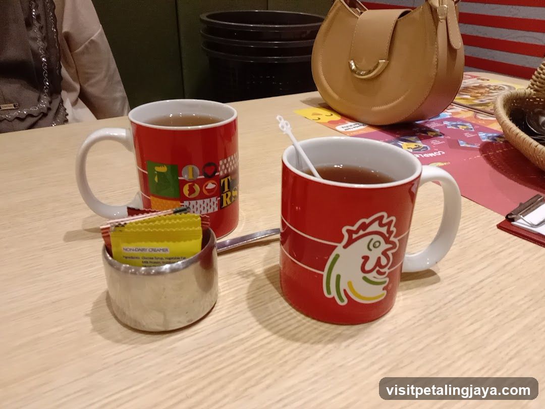 Red Mugs with Tea and Condiments