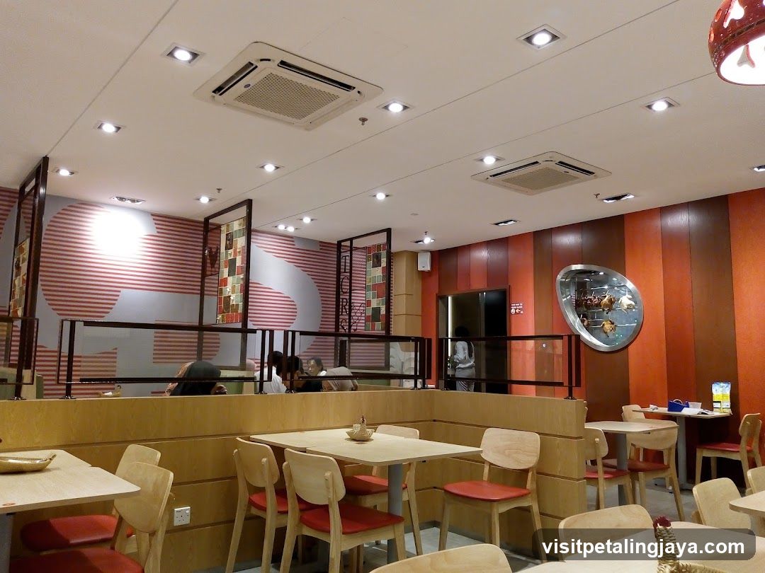 Restaurant Interior with Wooden Booths and Red Accents