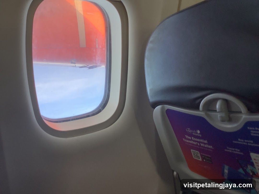 Airplane Window View with Seat Back Pocket