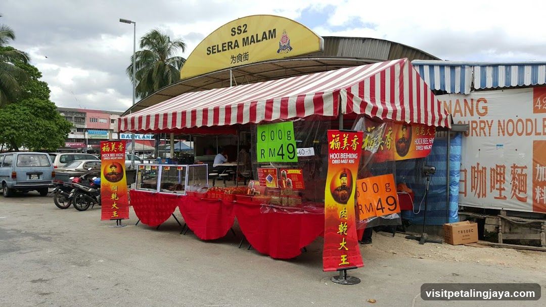 Street Food Stall with Red and White Canopy