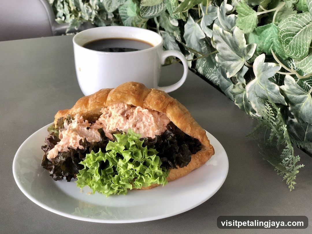Croissant Sandwich with Tuna Salad and Coffee