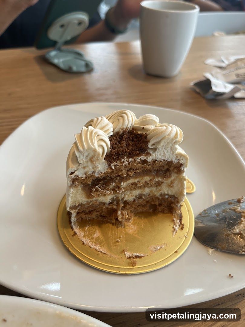 Slice of layered cake with cream frosting