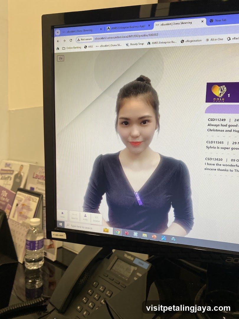 Computer Screen Displaying Staff Photo and Reviews