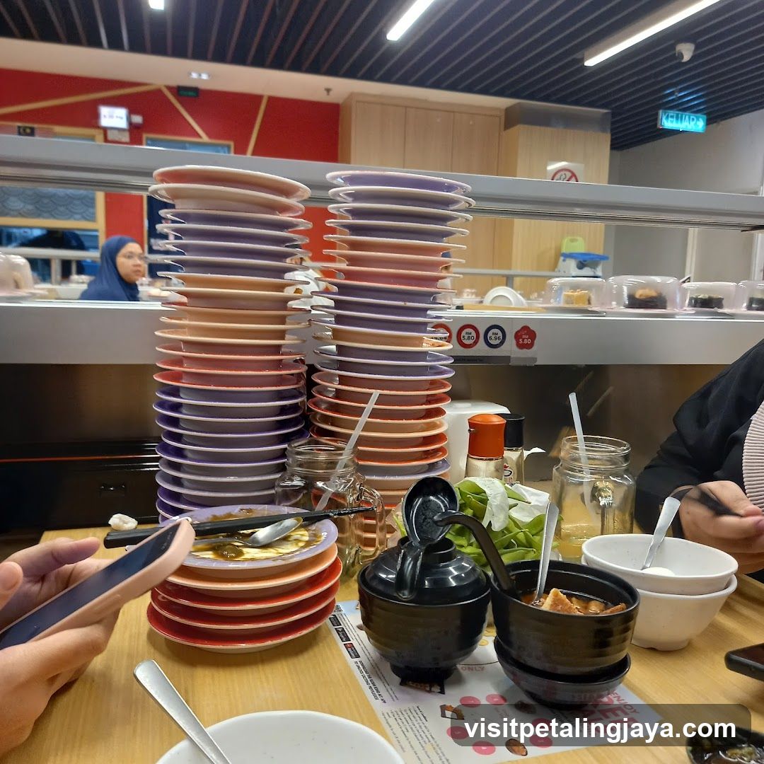 Dining at a restaurant with stacked plates and condiments