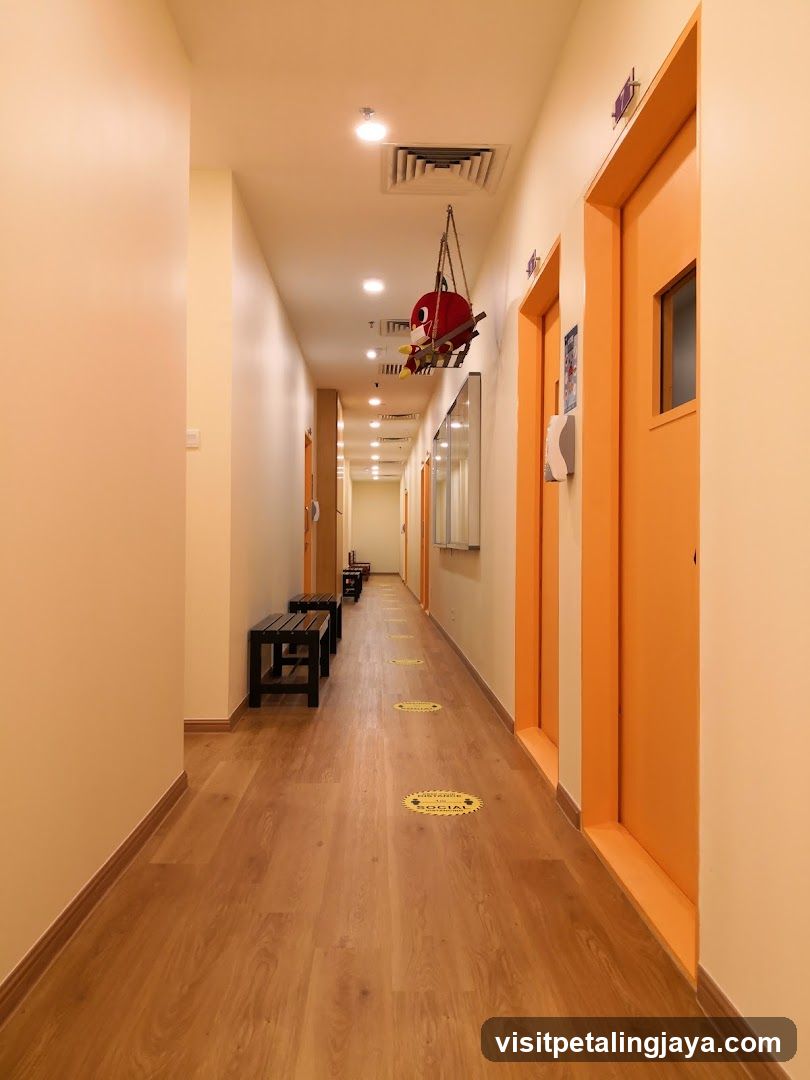 Brightly Lit Hallway with Orange Doors