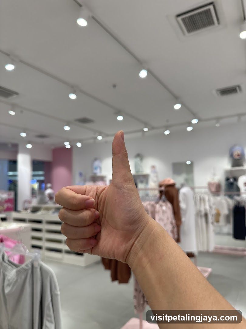Thumbs Up in Clothing Store Interior