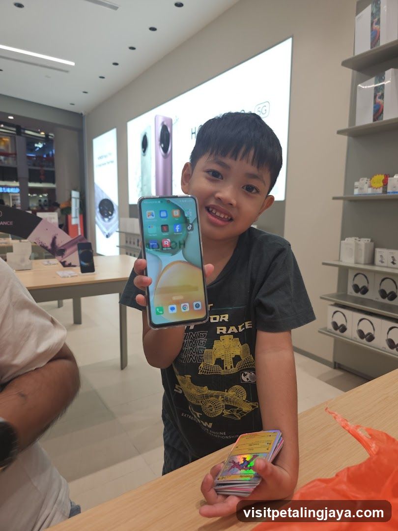 Boy showing smartphone in store