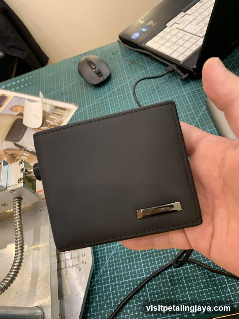 Black Wallet on Workbench
