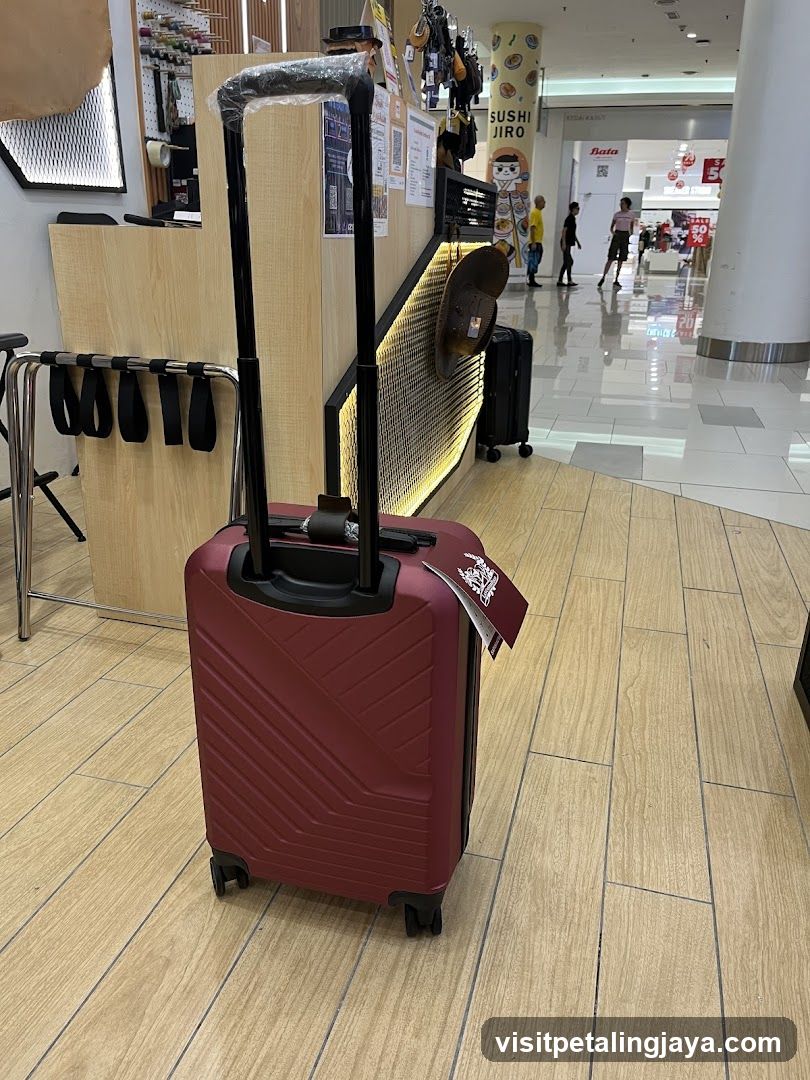 Red suitcase in mall interior