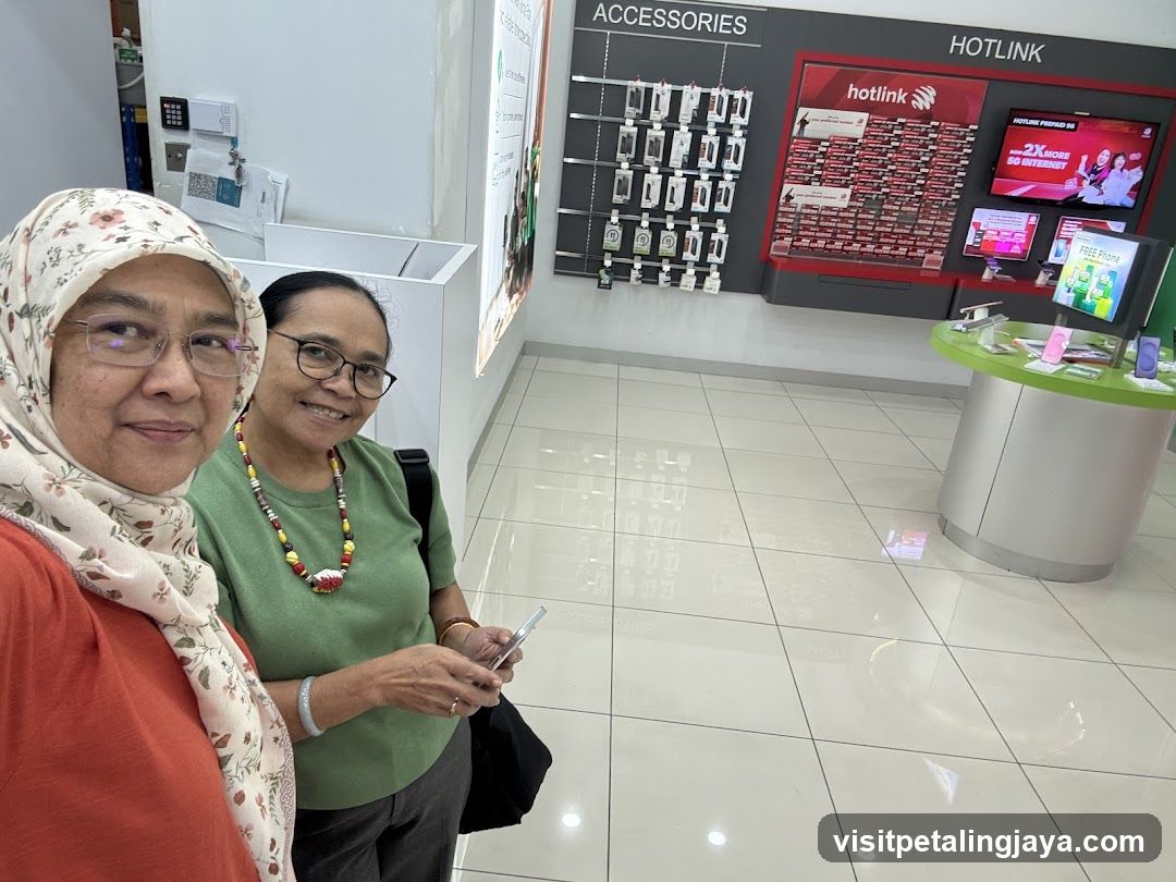 Two women in a mobile shop interior