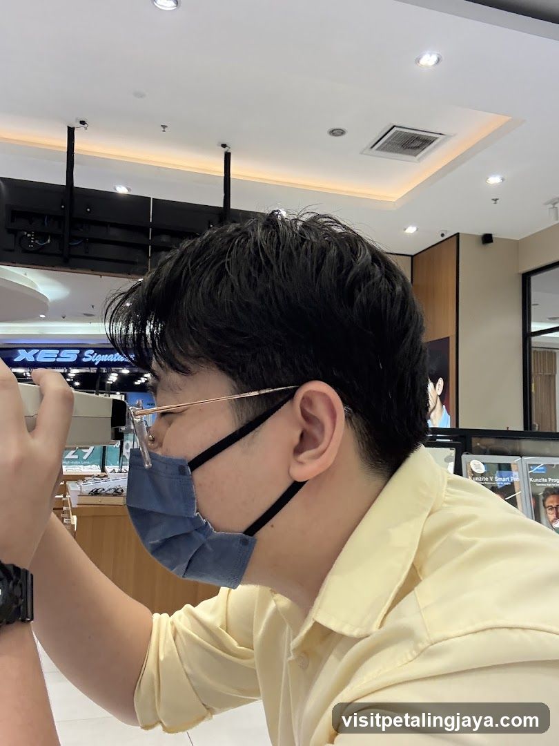 Person in Mask Looking at Phone