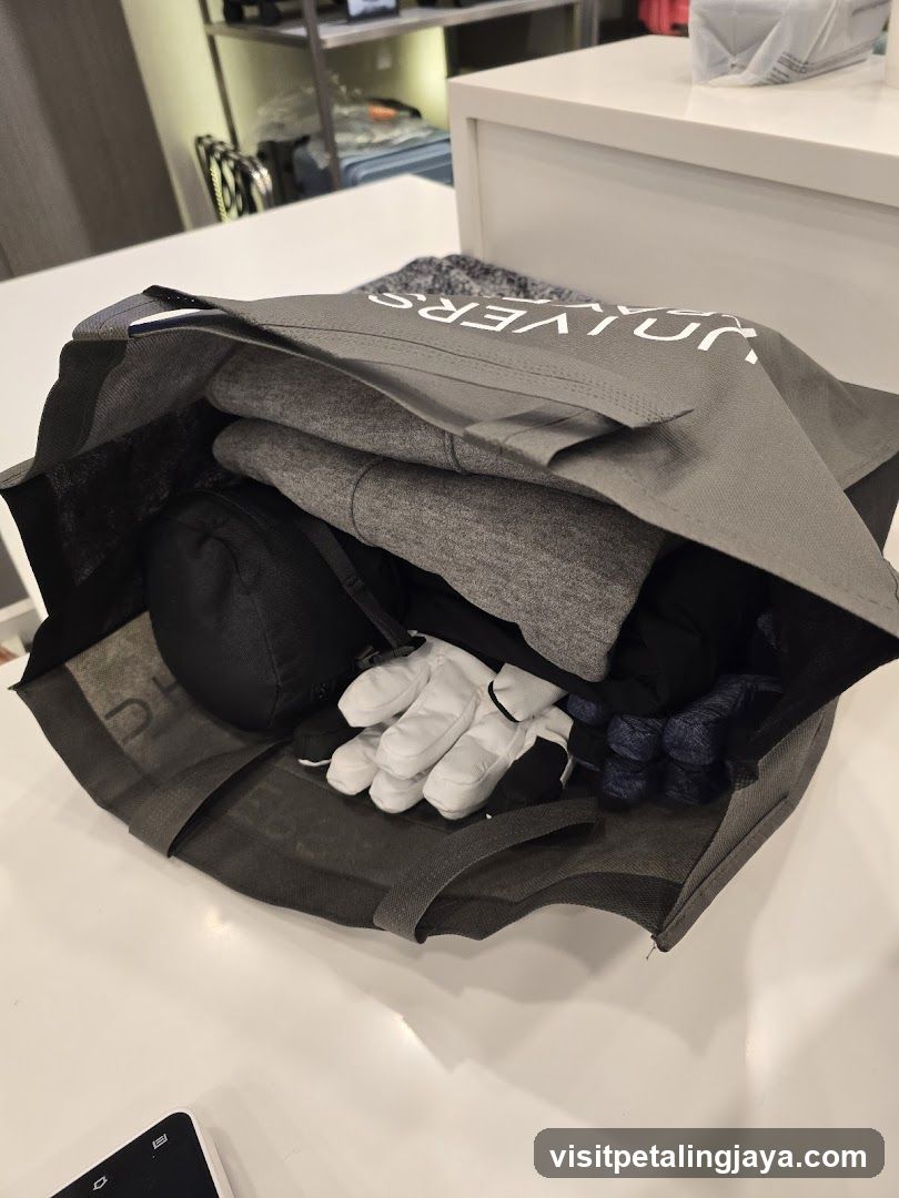 Shopping Bag with Folded Clothes and Accessories