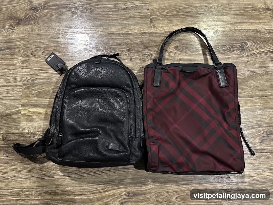Leather Backpack and Plaid Tote Bag on Wooden Floor