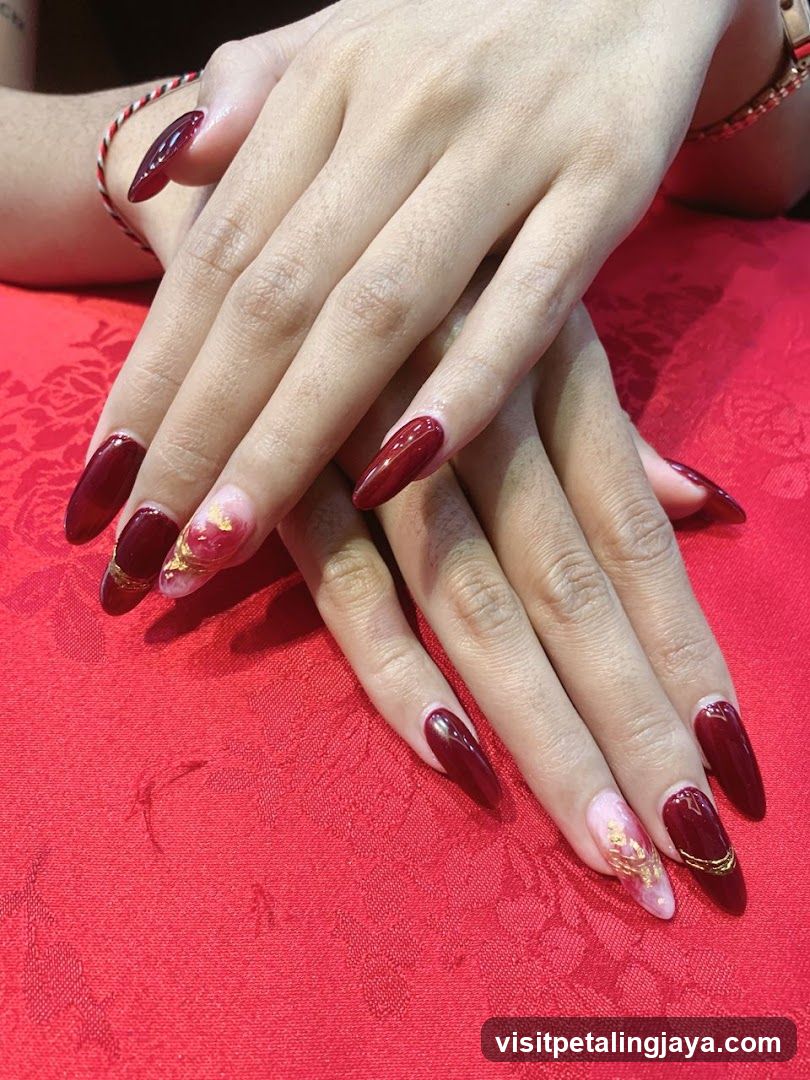 Red Nails with Gold Accents