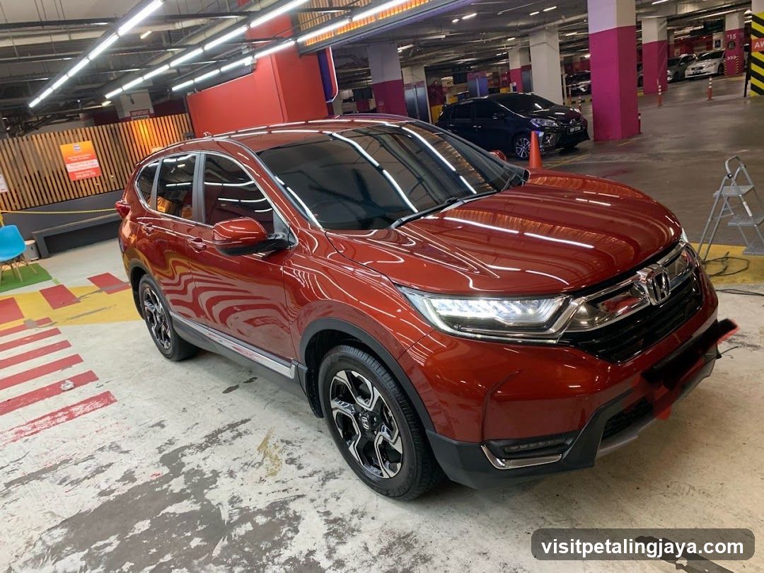 Red Honda CR-V in Parking Garage