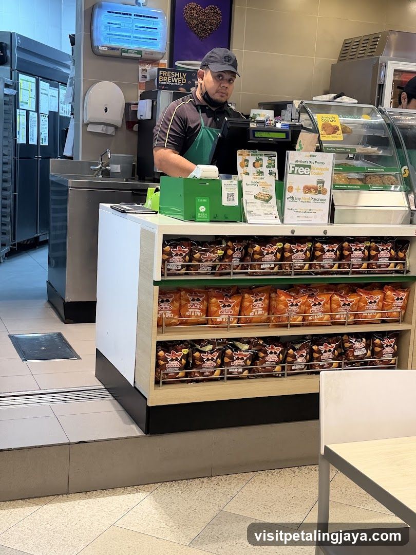Coffee Shop Interior with Staff and Snacks