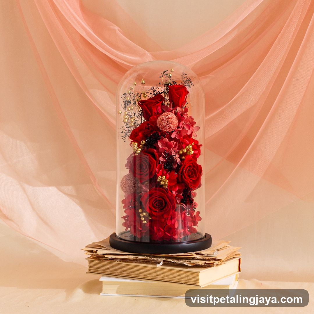 Red Floral Arrangement Under Glass Dome