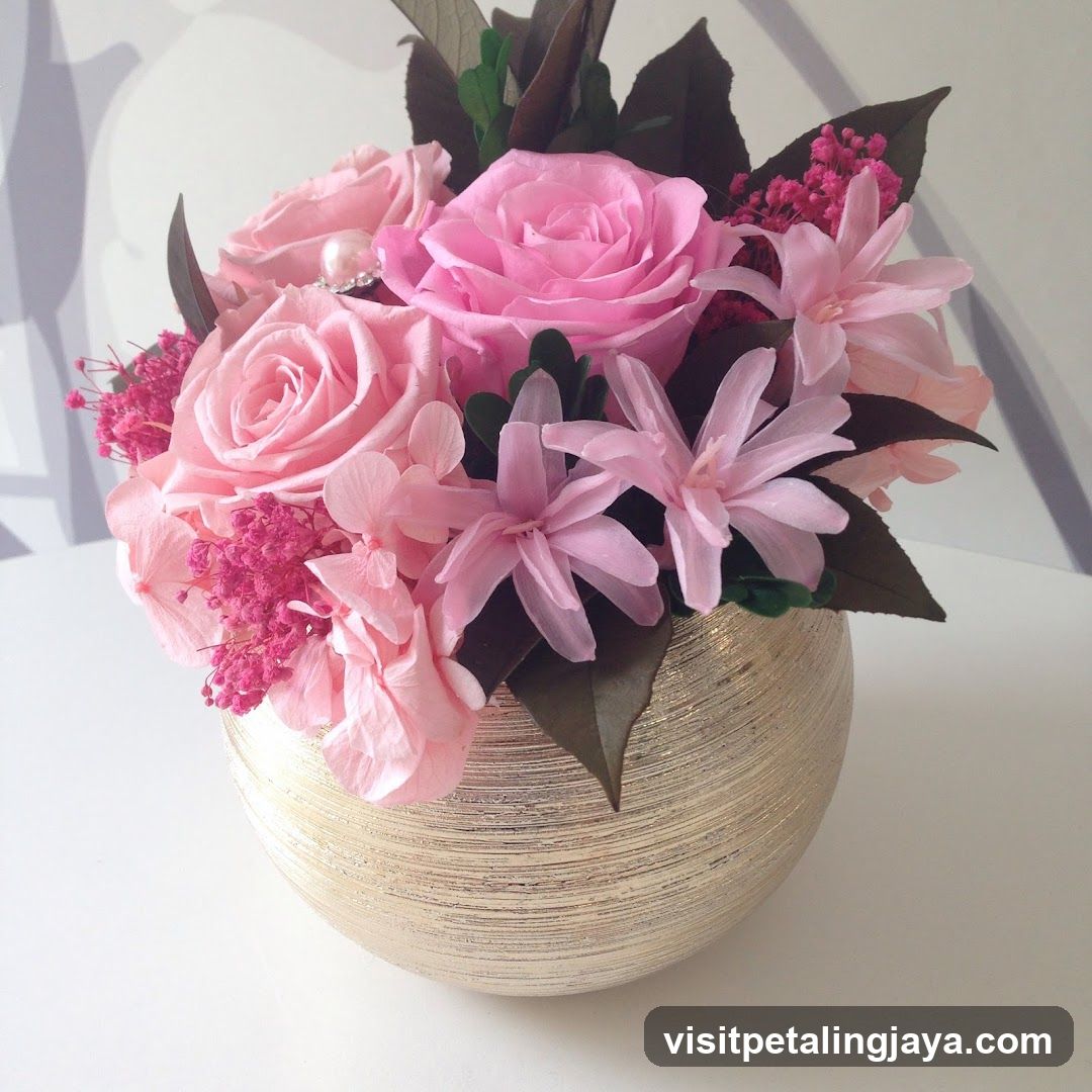 Pink Floral Arrangement in Gold Vase