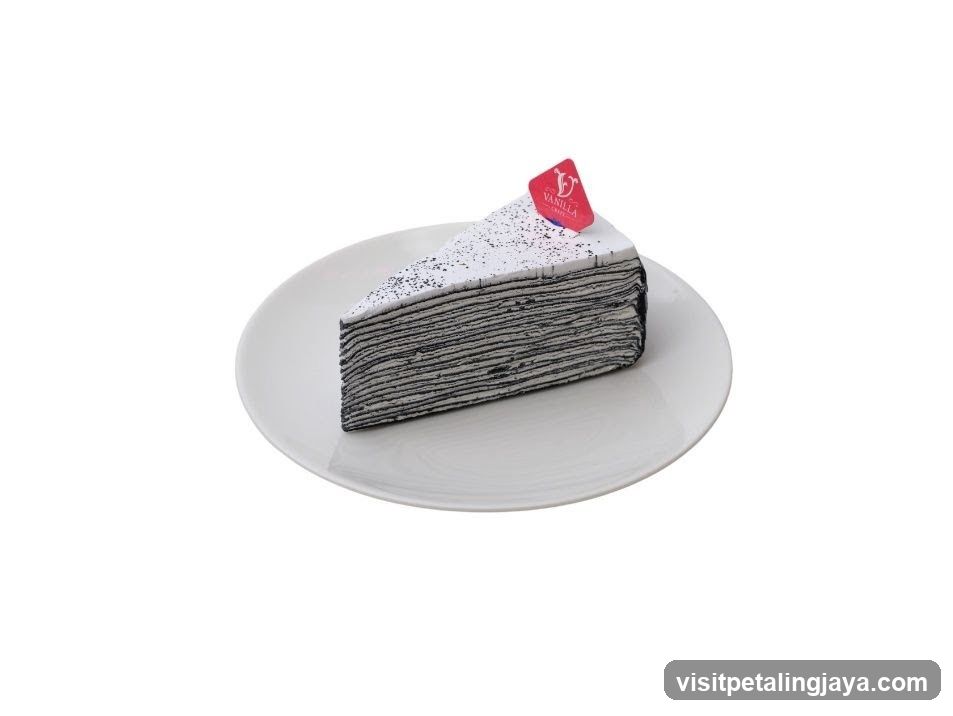 Slice of layered cake on a white plate