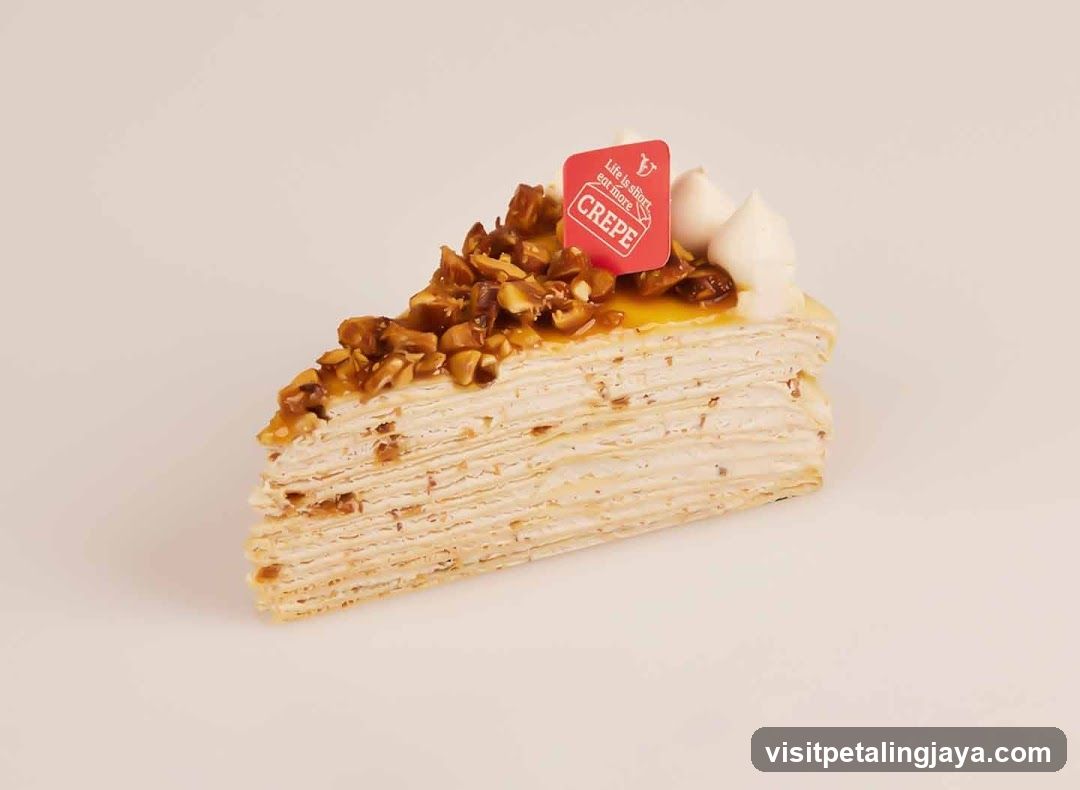 Crepé Cake Slice with Walnut Topping
