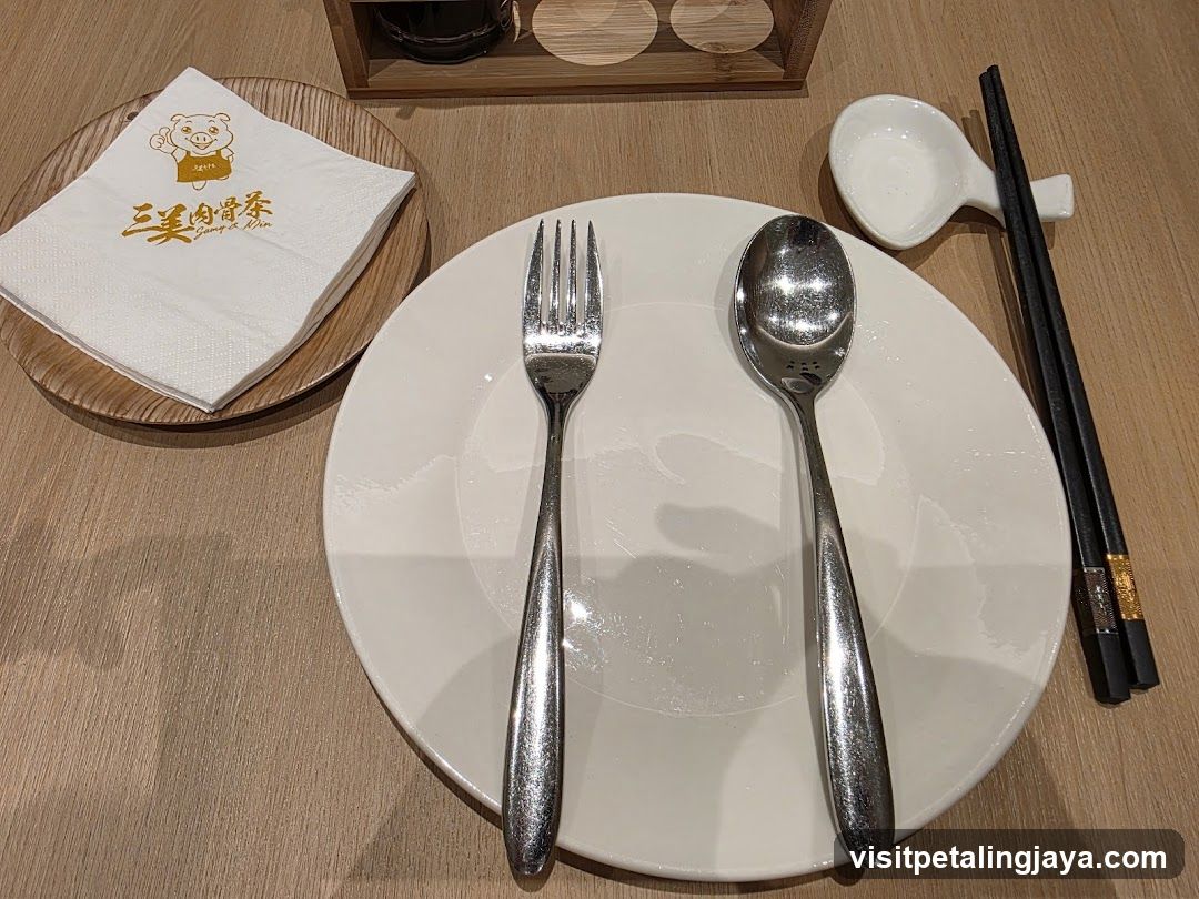 Dining Table Setting with Cutlery and Napkin