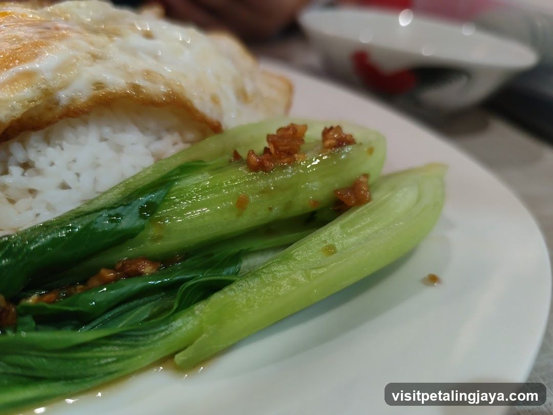 Bowl of rice with egg and bok choy