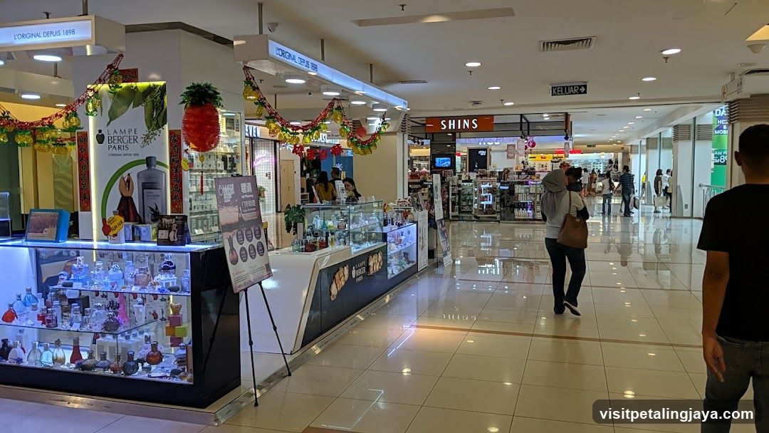 Shopping Mall Interior with Cosmetics Booths